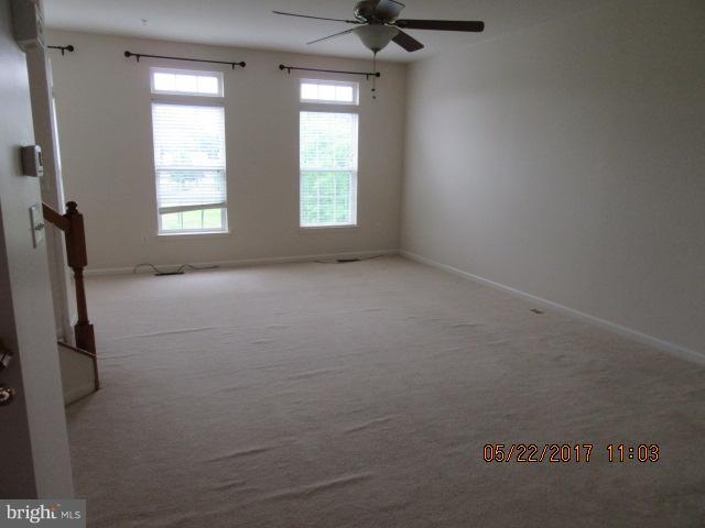 9305 Summit View Way Perry Hall, MD 21128 - Photo 5 of 12 a view of an empty room with windows