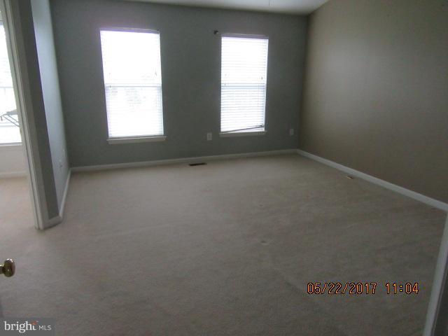 9305 Summit View Way Perry Hall, MD 21128 - Photo 7 of 12 an empty room with windows