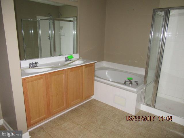 9305 Summit View Way Perry Hall, MD 21128 - Photo 8 of 12 a bathroom with a tub sink and mirror