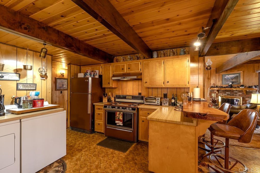 42535 Avalon Road Big Bear Lake, CA 92315 - Photo 11 of 26 a kitchen with lots of counter top space and stainless steel appliances