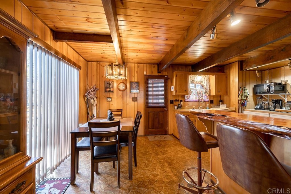 42535 Avalon Road Big Bear Lake, CA 92315 - Photo 14 of 26 a dining room with furniture and wooden floor