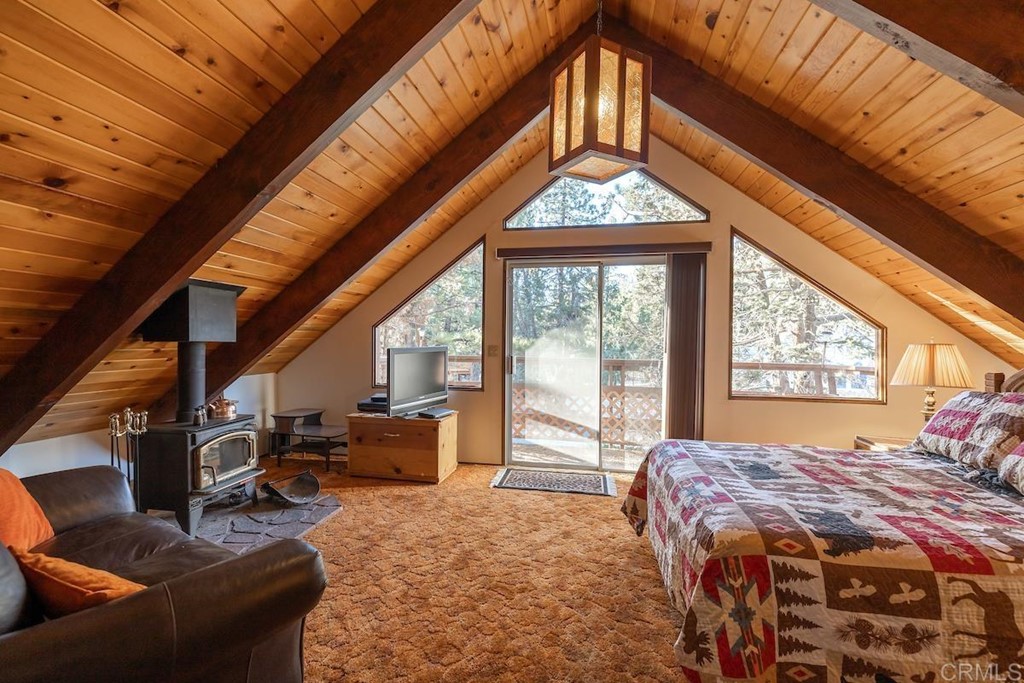 42535 Avalon Road Big Bear Lake, CA 92315 - Photo 21 of 26 a bedroom with a bed and a large window