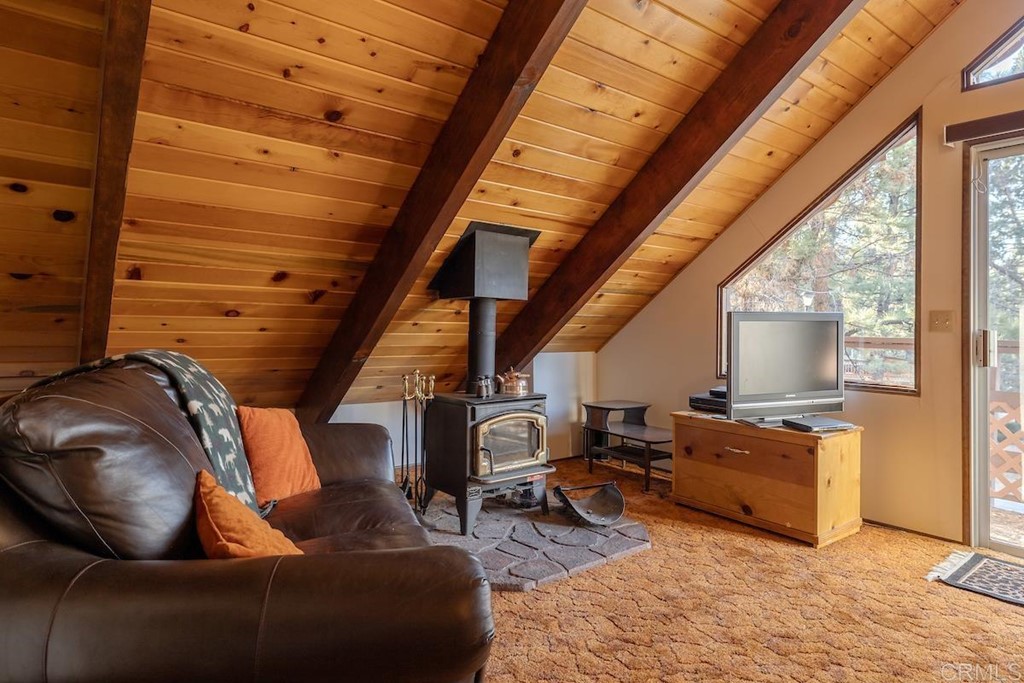 42535 Avalon Road Big Bear Lake, CA 92315 - Photo 23 of 26 a living room with furniture and a flat screen tv
