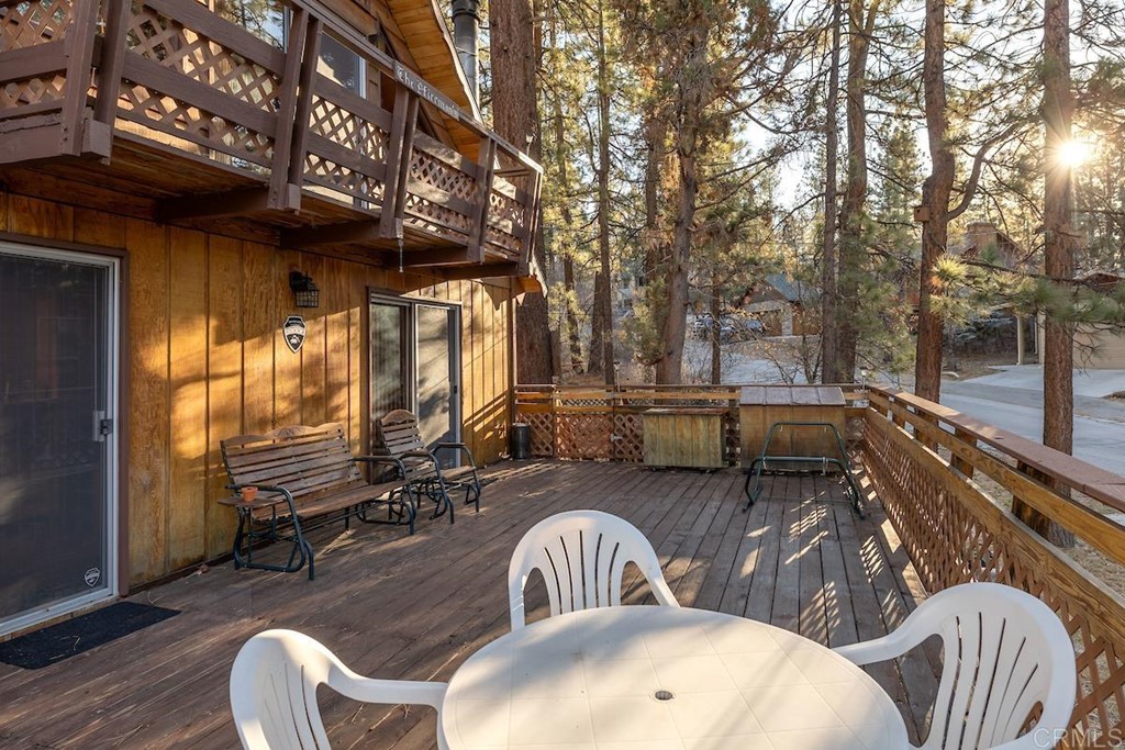 42535 Avalon Road Big Bear Lake, CA 92315 - Photo 24 of 26 a backyard of a house with barbeque oven table and chairs