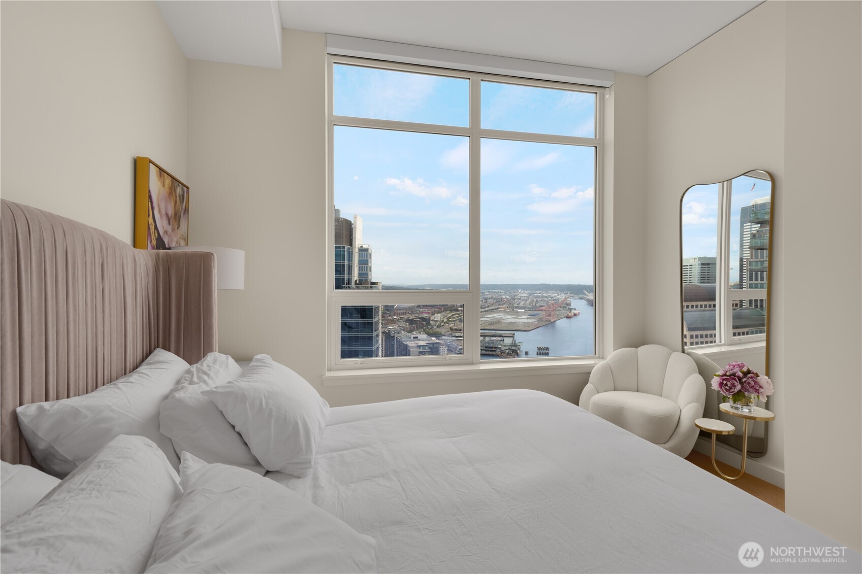 121 Stewart Street, Unit 3504 Seattle, WA 98101 - Photo 13 of 31 a bedroom with furniture and a large window