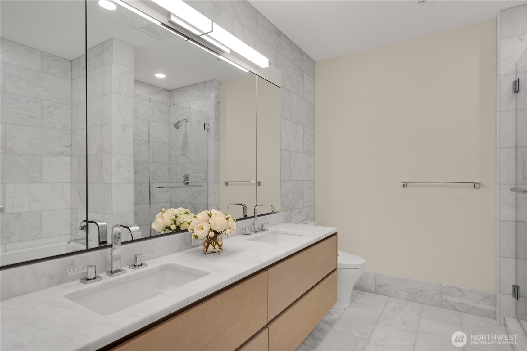 121 Stewart Street, Unit 3504 Seattle, WA 98101 - Photo 15 of 31 a bathroom with a double vanity sink and mirror