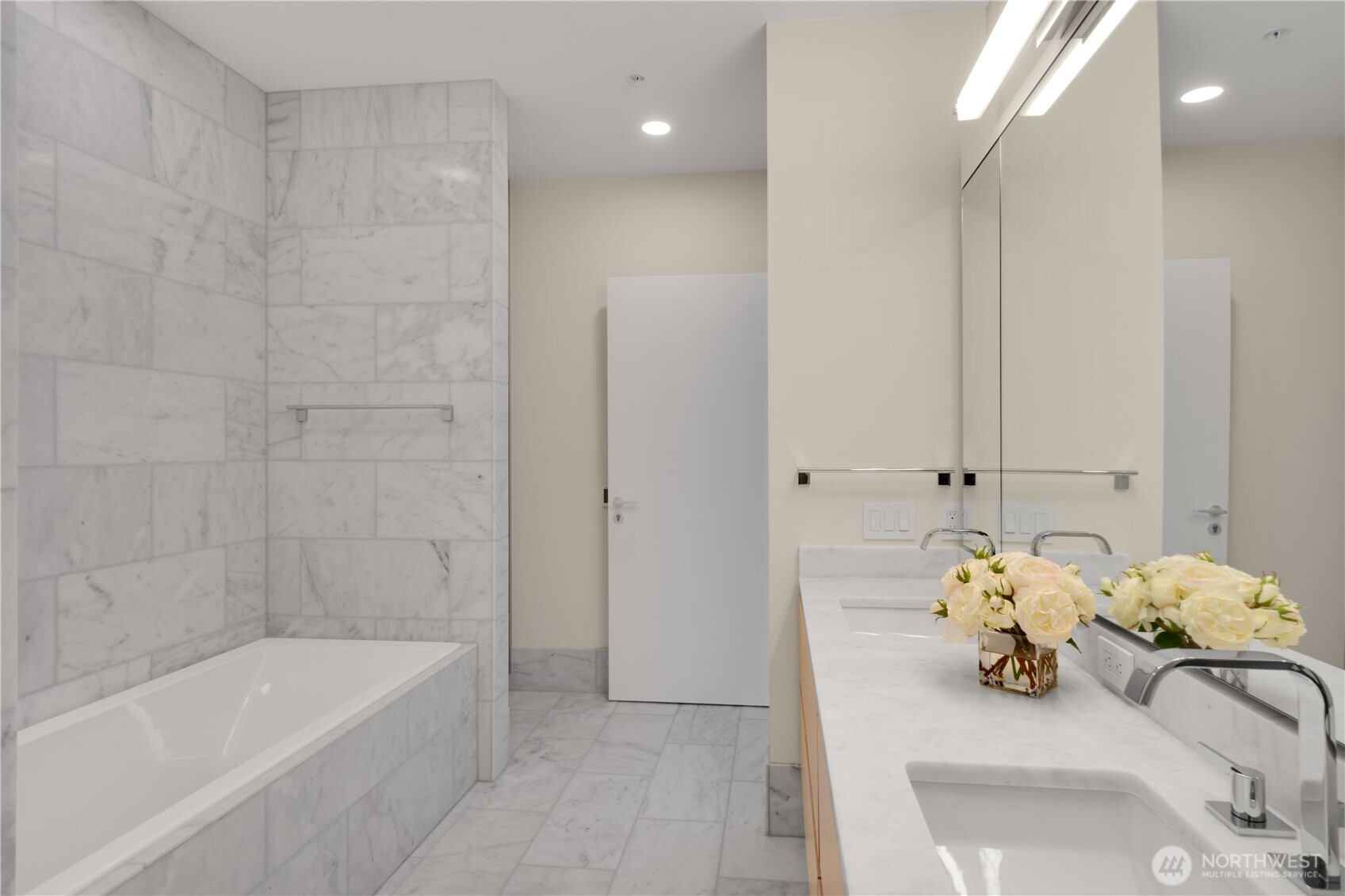 121 Stewart Street, Unit 3504 Seattle, WA 98101 - Photo 16 of 31 a white bath tub sitting next to a shower