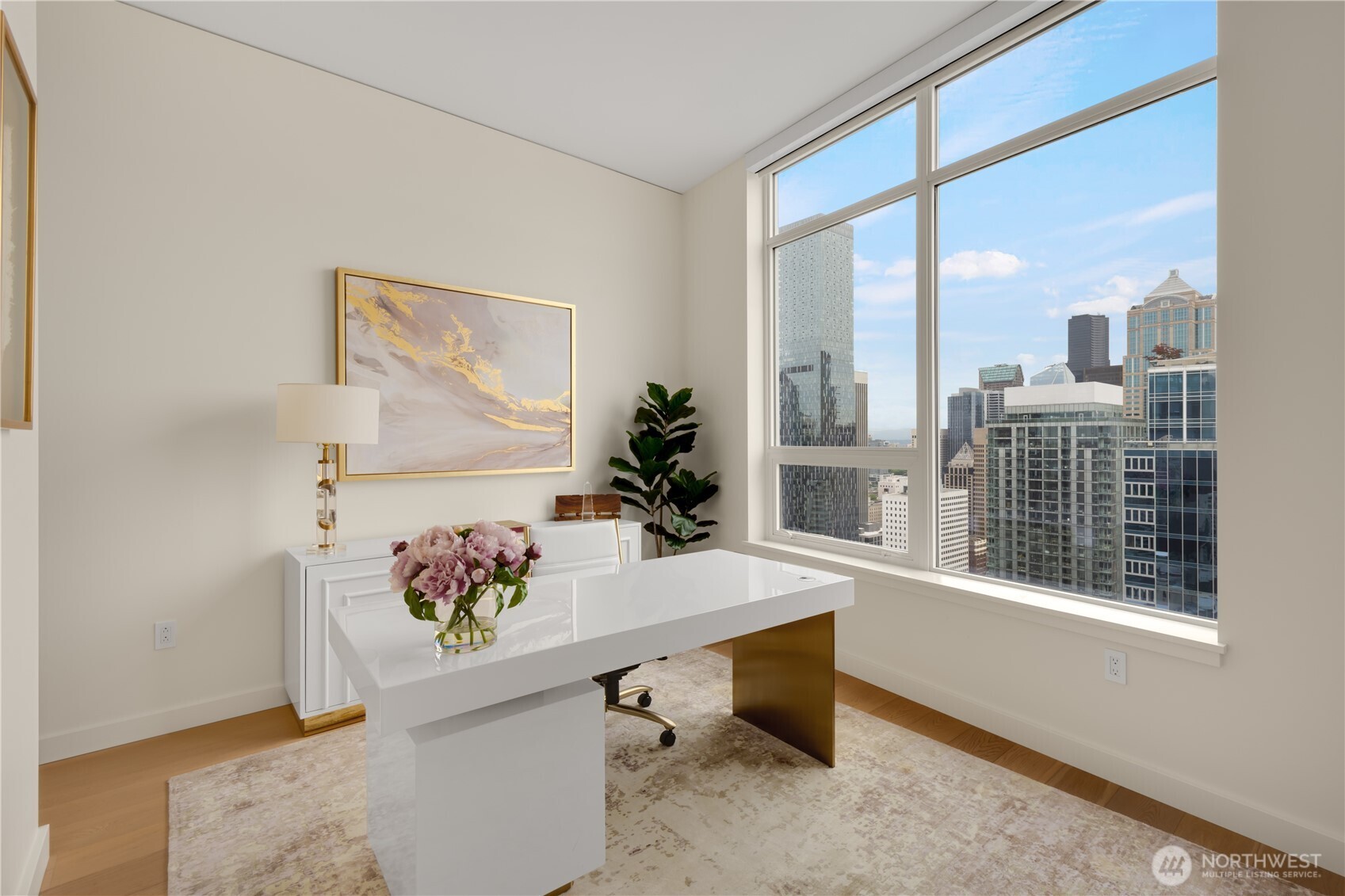 121 Stewart Street, Unit 3504 Seattle, WA 98101 - Photo 17 of 31 a view of a workspace with furniture and a window