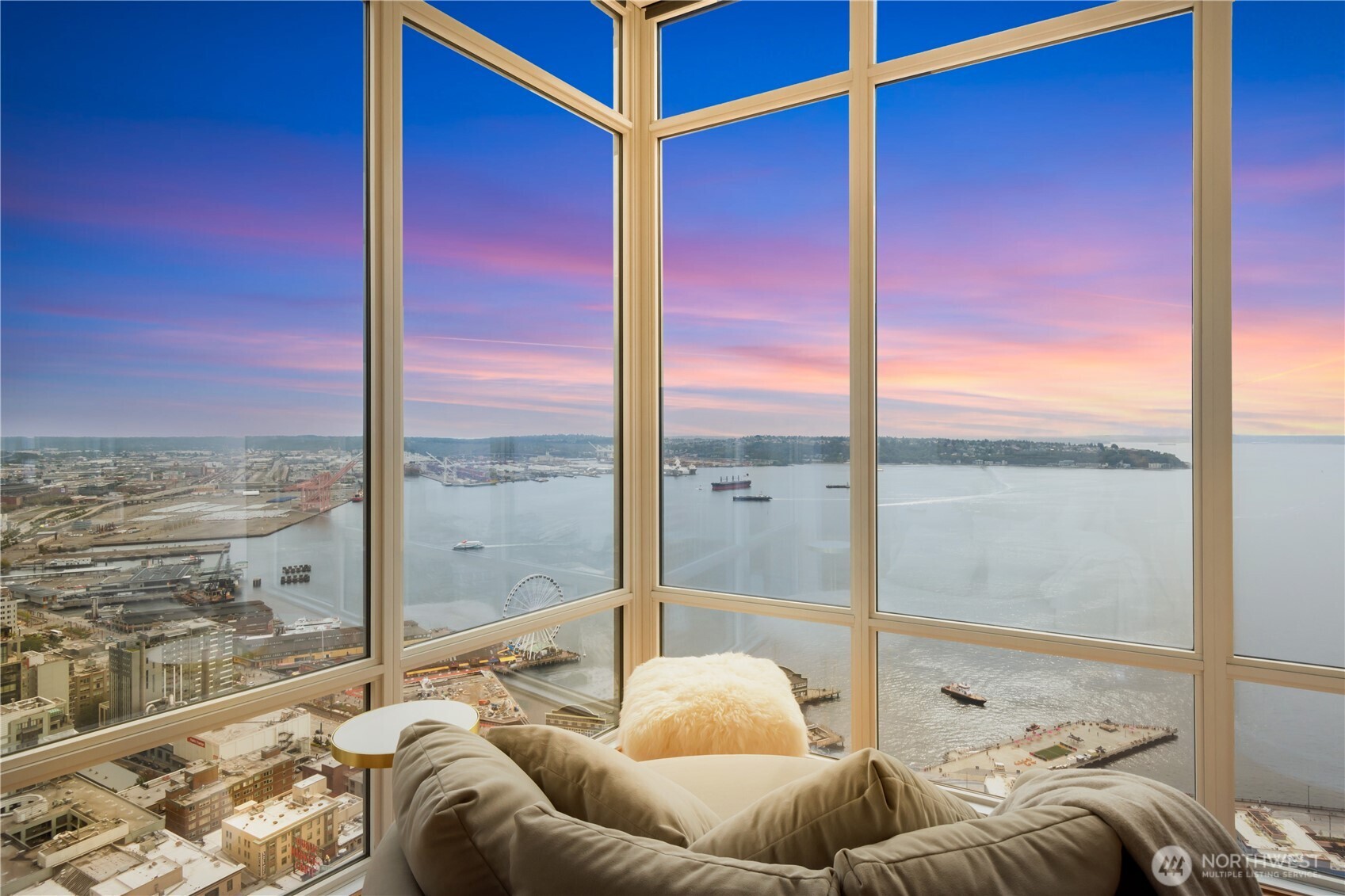 121 Stewart Street, Unit 3504 Seattle, WA 98101 - Photo 3 of 31 a living room with furniture and floor to ceiling window