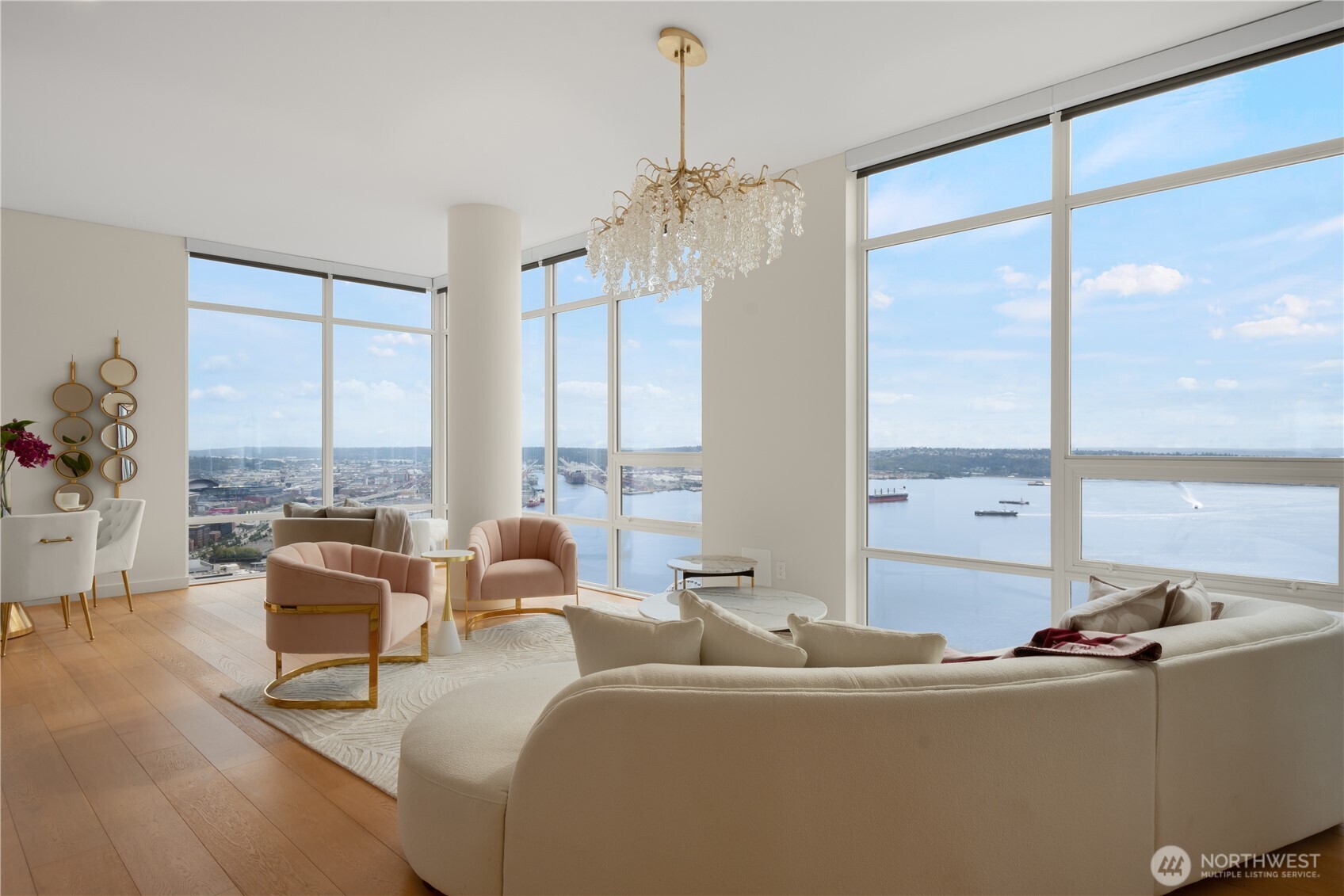 121 Stewart Street, Unit 3504 Seattle, WA 98101 - Photo 6 of 31 a living room with furniture and large windows