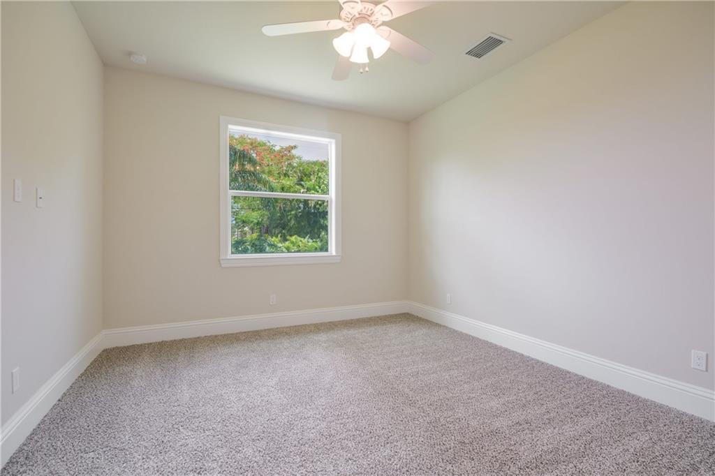 2035 Northwest Fork Road Stuart, FL 34994 - Photo 18 of 37 an empty room with a window