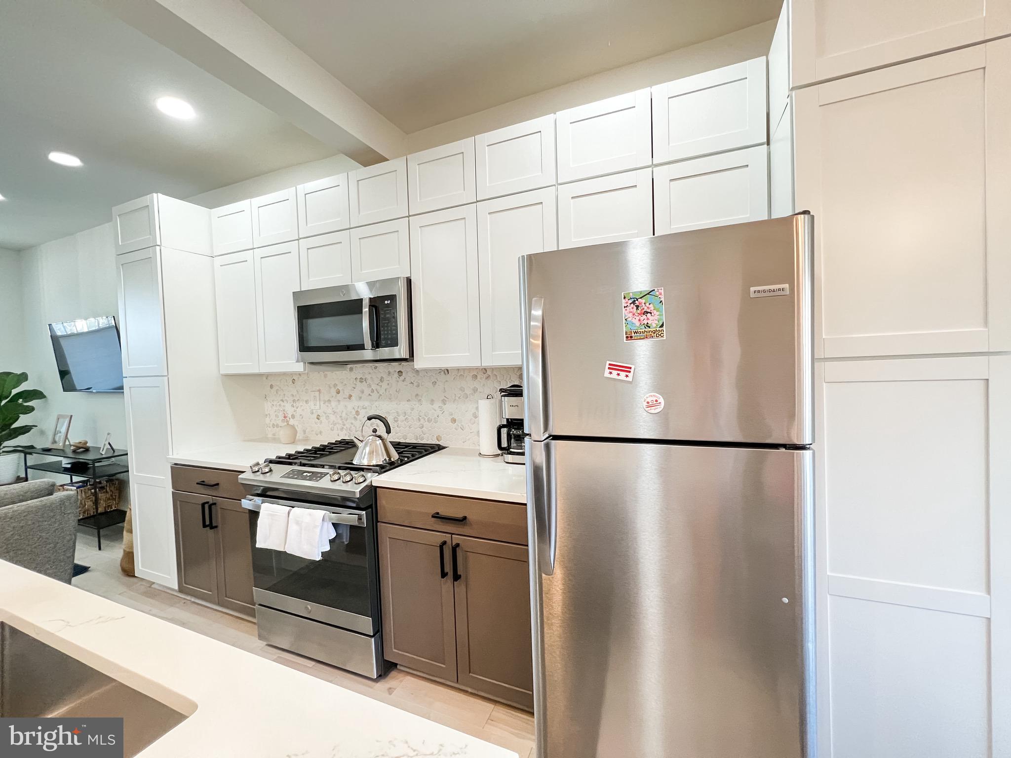 3424 9th Street Northeast Washington, DC 20017 - Photo 12 of 32 a white refrigerator freezer sitting in a kitchen
