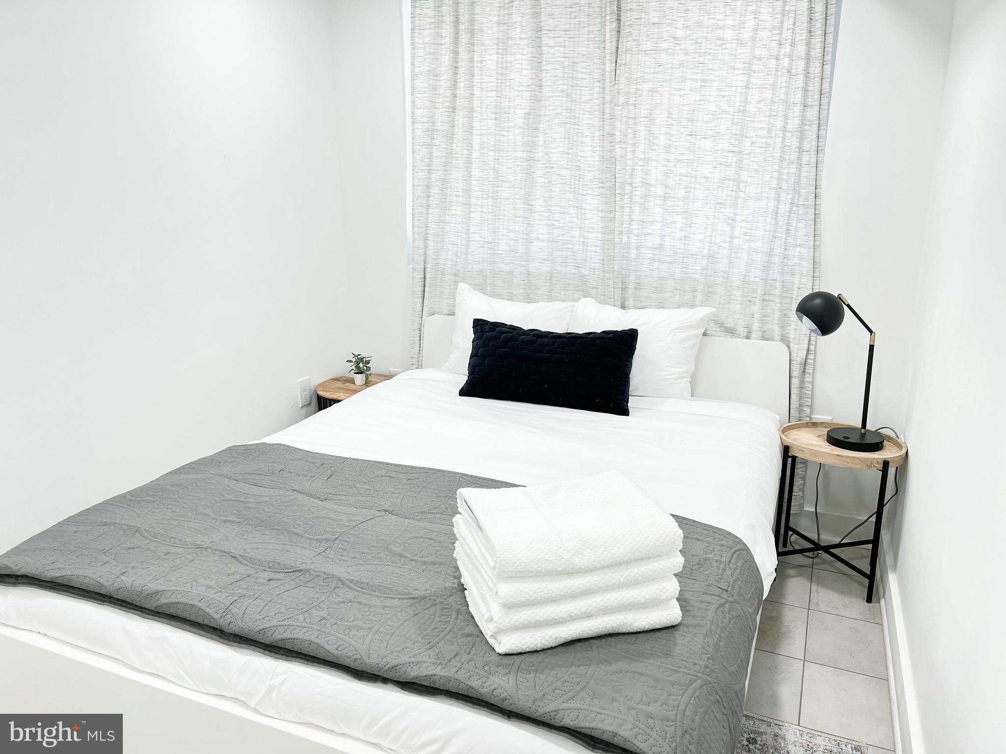 3424 9th Street Northeast Washington, DC 20017 - Photo 15 of 32 a bedroom with a bed and window