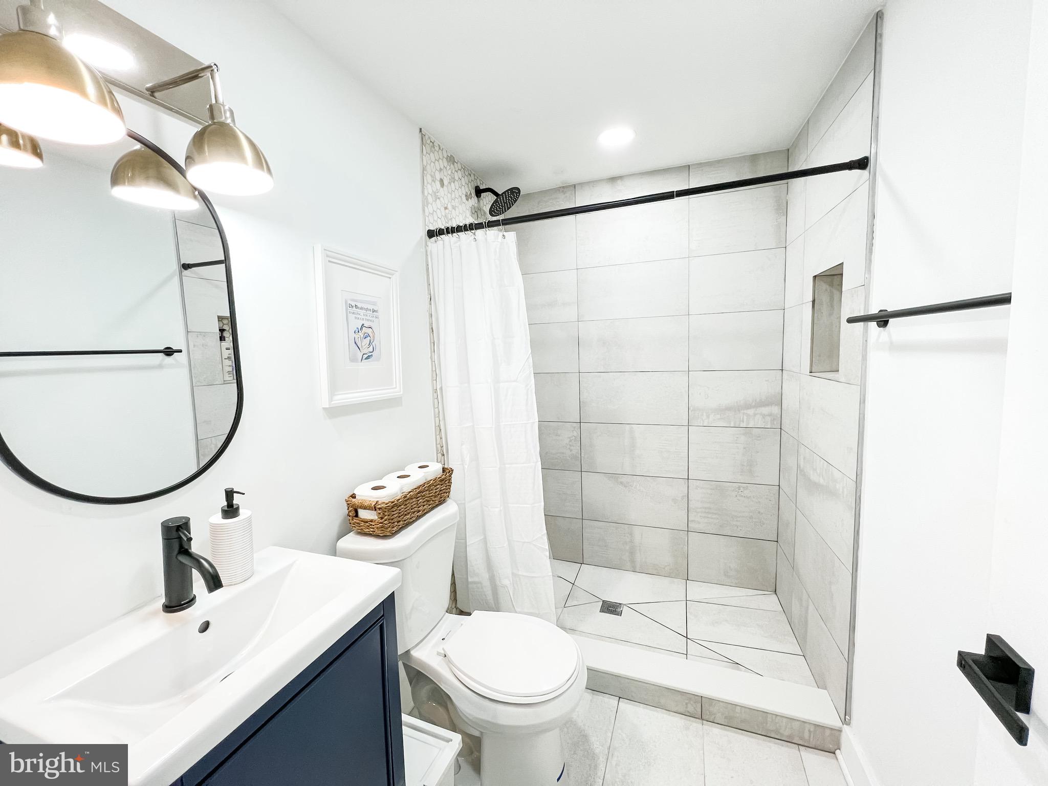 3424 9th Street Northeast Washington, DC 20017 - Photo 18 of 32 a bathroom with a sink toilet and shower