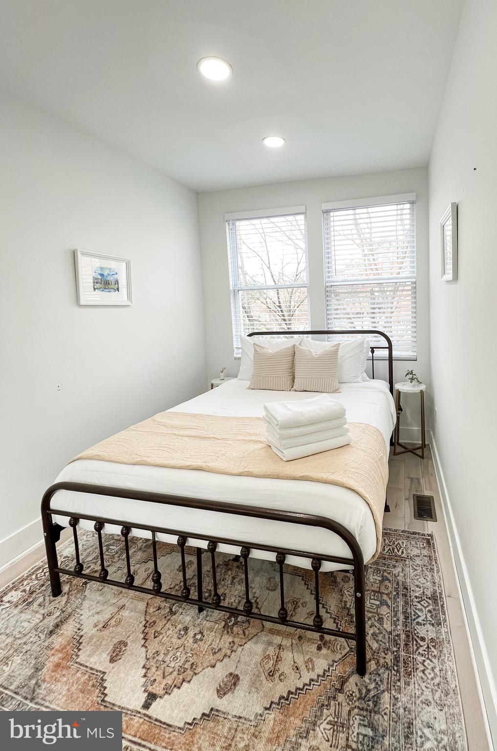 3424 9th Street Northeast Washington, DC 20017 - Photo 30 of 32 a bedroom with a bed and a window