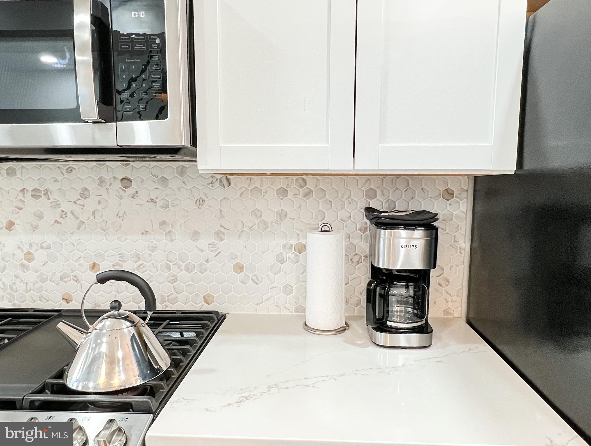 3424 9th Street Northeast Washington, DC 20017 - Photo 10 of 32 a kitchen with a sink and a stove top oven