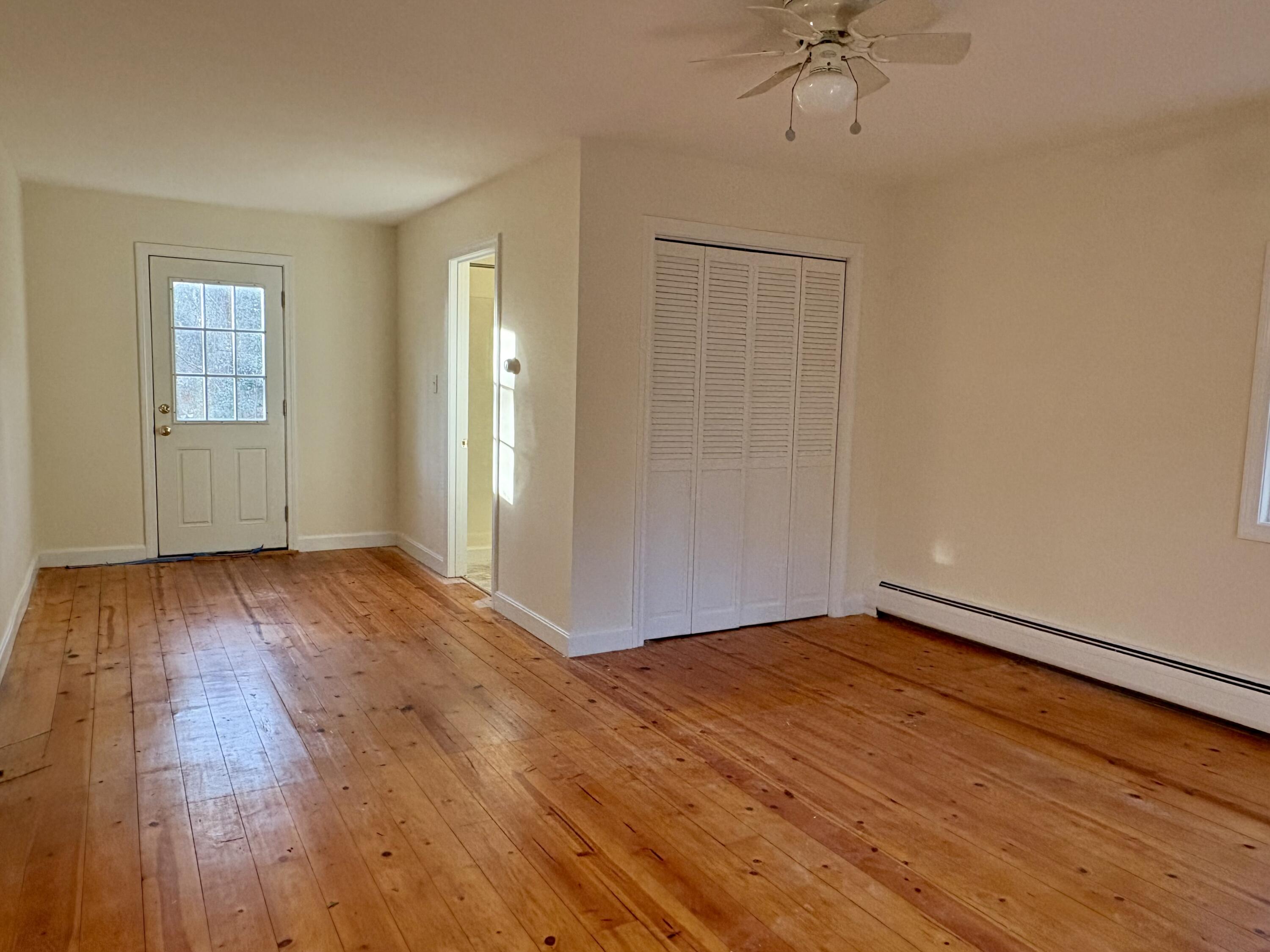 55 Chickadee Lane Centerville, MA 02632 - Photo 14 of 26 a view of an empty room with wooden floor and a window