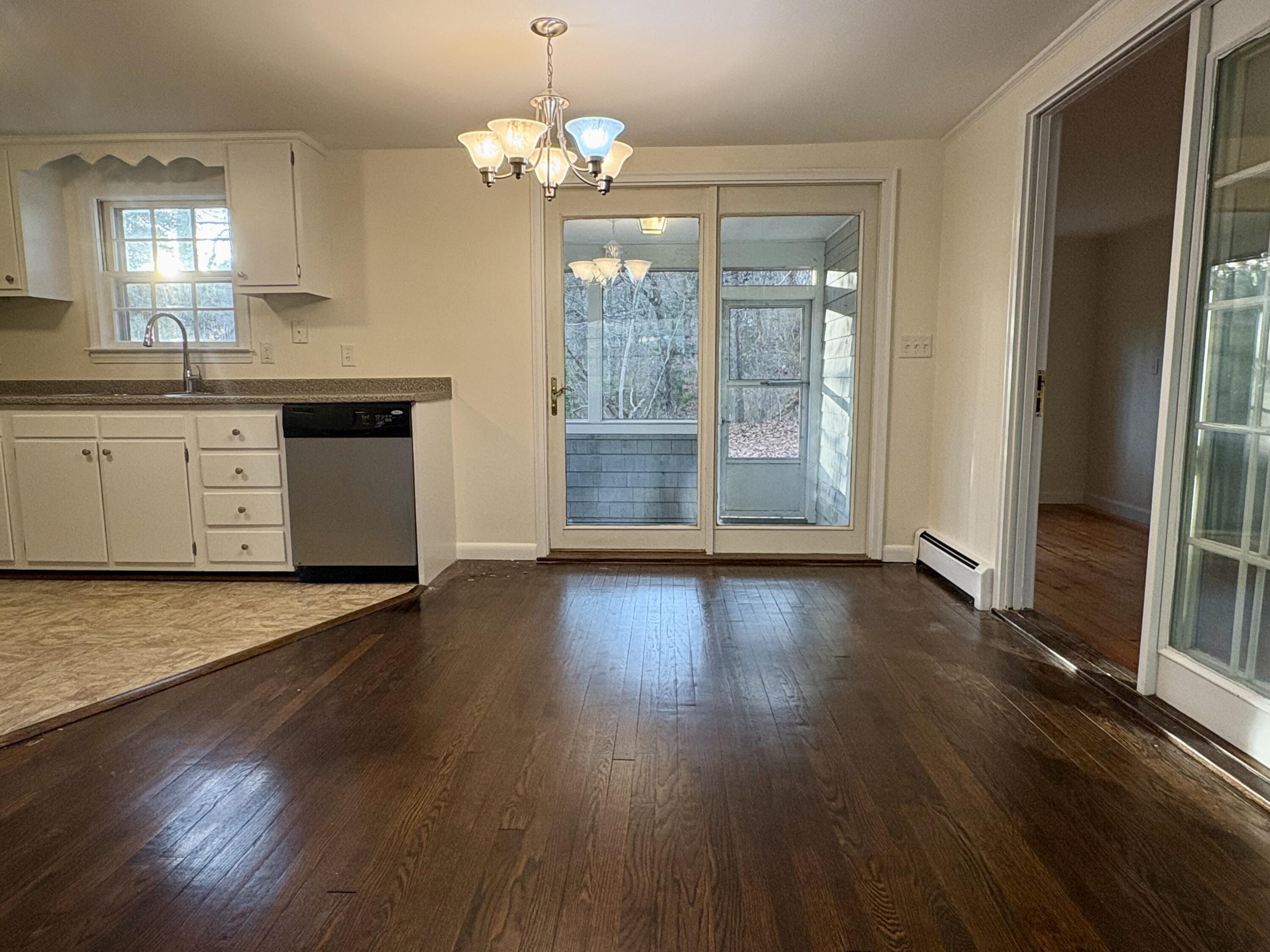 55 Chickadee Lane Centerville, MA 02632 - Photo 8 of 26 wooden floor in an empty room with a window