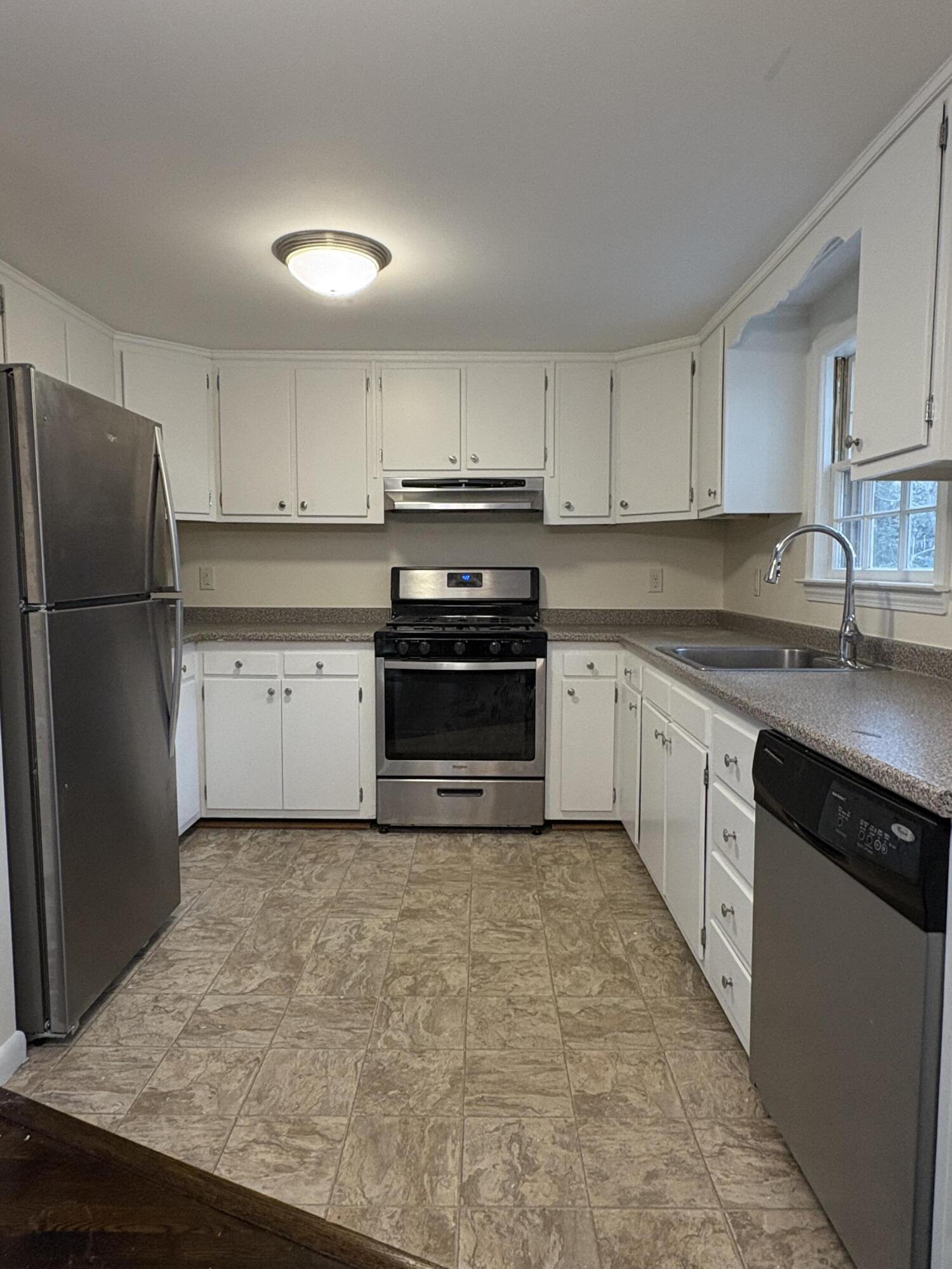 55 Chickadee Lane Centerville, MA 02632 - Photo 10 of 26 a kitchen with cabinets stainless steel appliances and a counter space