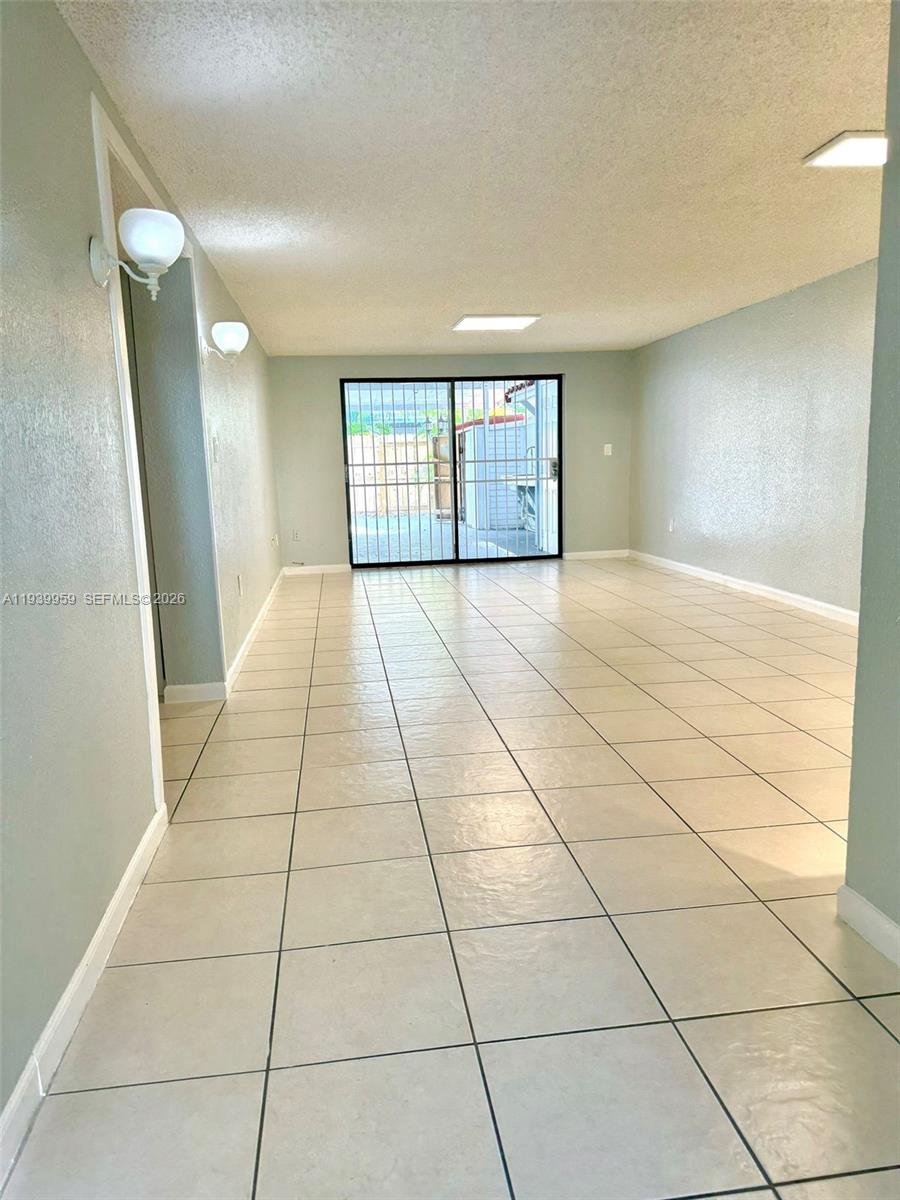 220 West 68th Street, Unit 101 Hialeah, FL 33014 - Photo 11 of 28 a view of an empty room and window