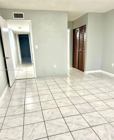 a view of a room with a bathroom