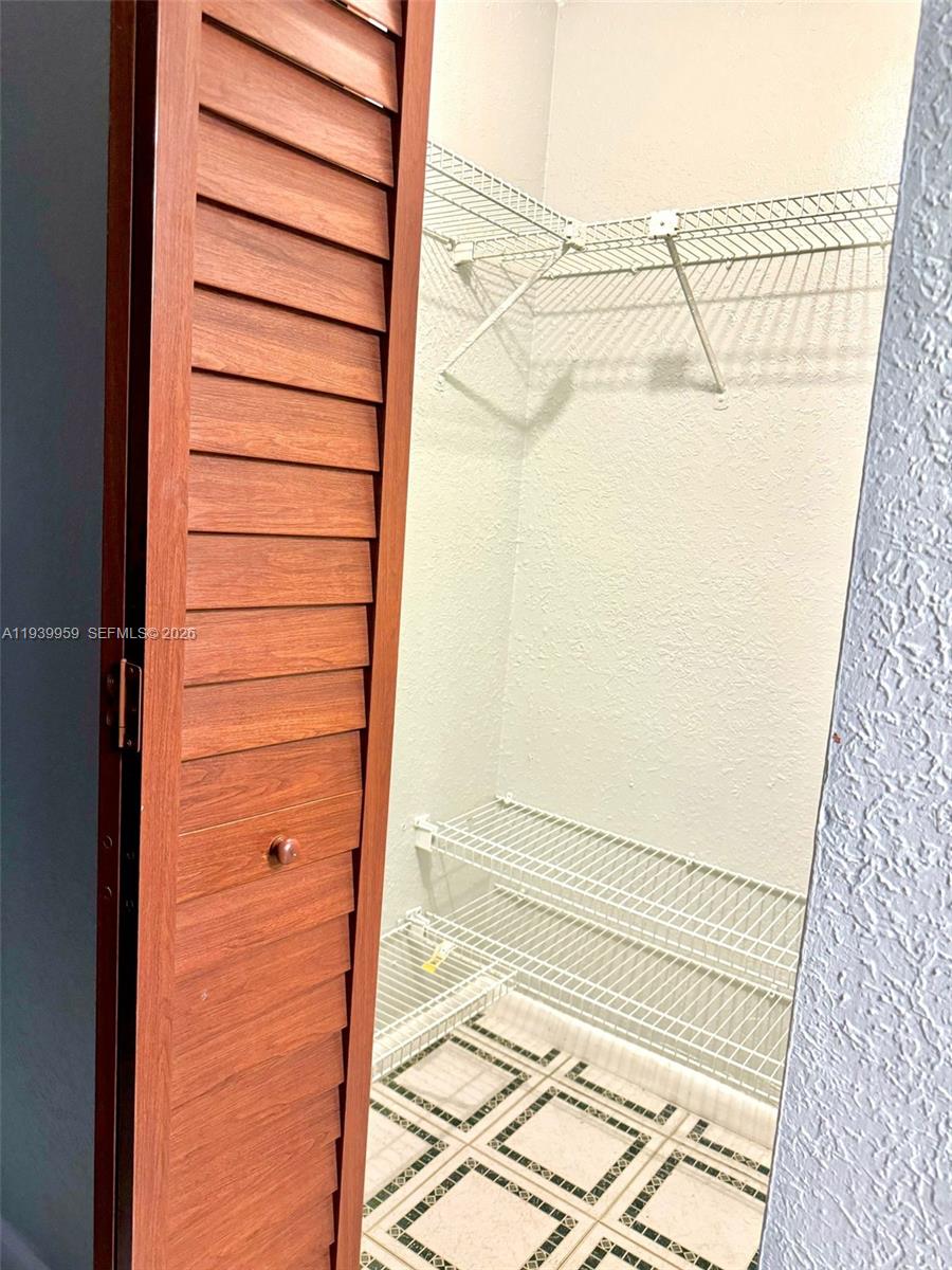 220 West 68th Street, Unit 101 Hialeah, FL 33014 - Photo 16 of 28 a view of a walk in closet