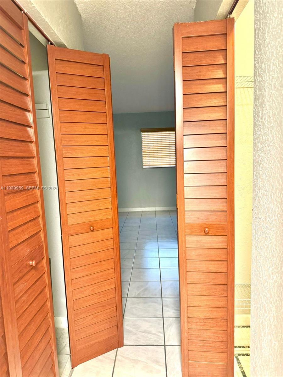 220 West 68th Street, Unit 101 Hialeah, FL 33014 - Photo 17 of 28 a view of a door and a window