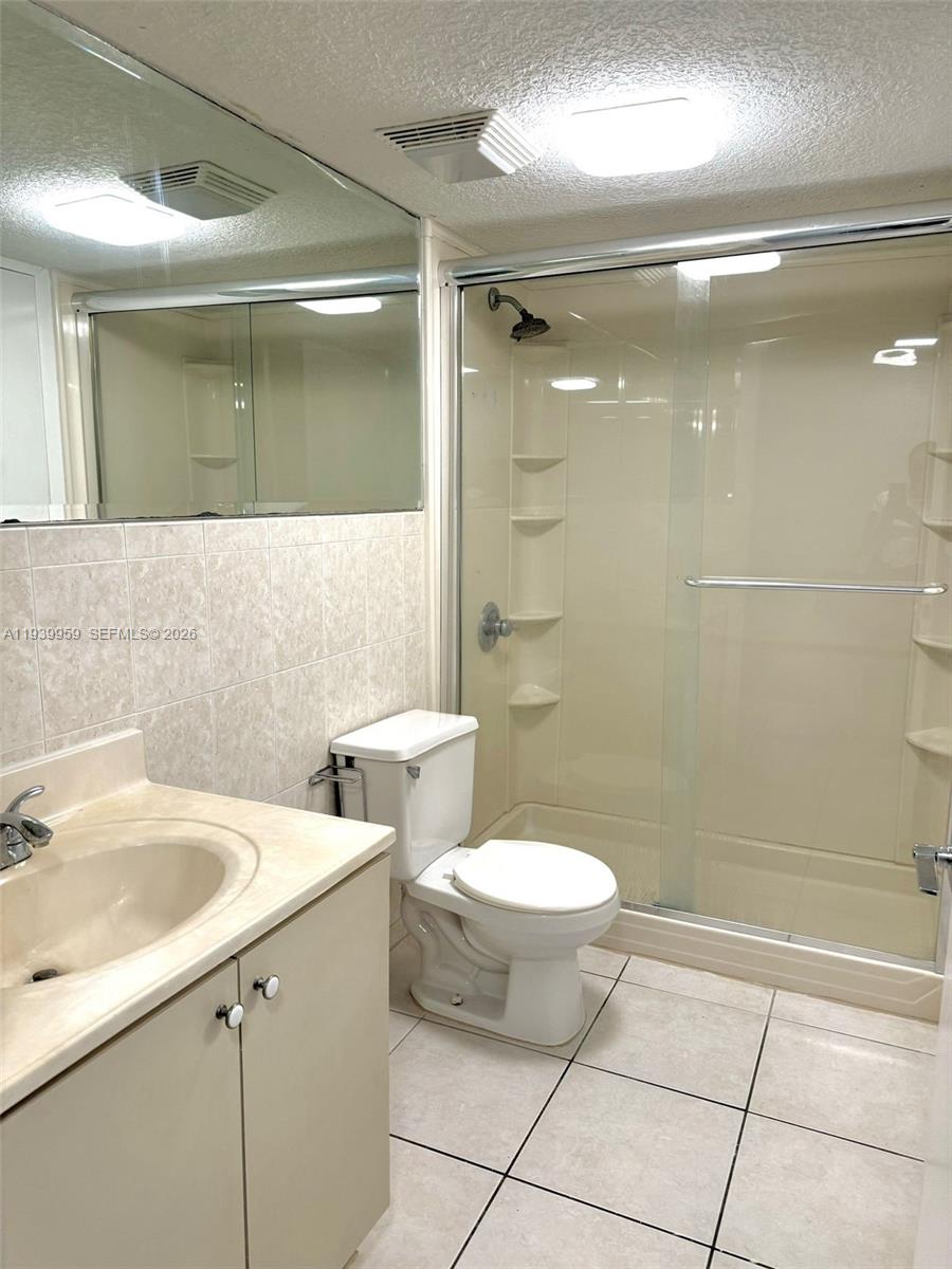 220 West 68th Street, Unit 101 Hialeah, FL 33014 - Photo 19 of 28 a bathroom with a sink and mirror