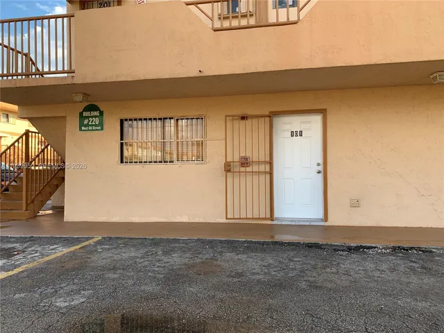 a kitchen with a stove sink and cabinets