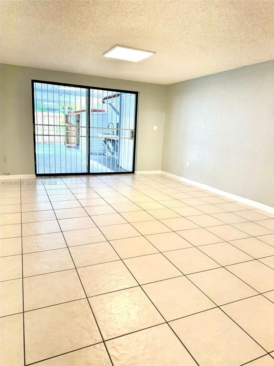 220 West 68th Street, Unit 101 Hialeah, FL 33014 - Photo 22 of 28 a view of an empty room and window