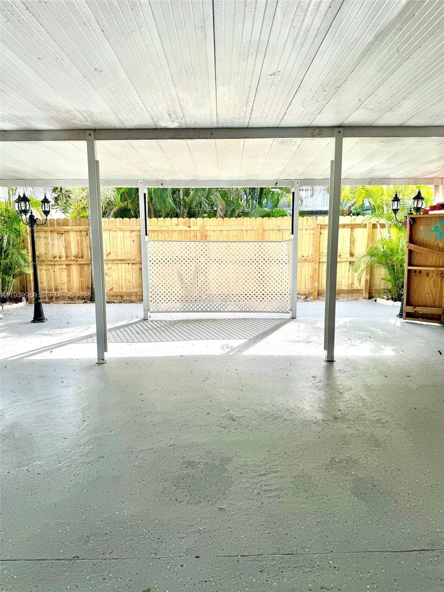 220 West 68th Street, Unit 101 Hialeah, FL 33014 - Photo 23 of 28 a view of an empty room with a sliding door