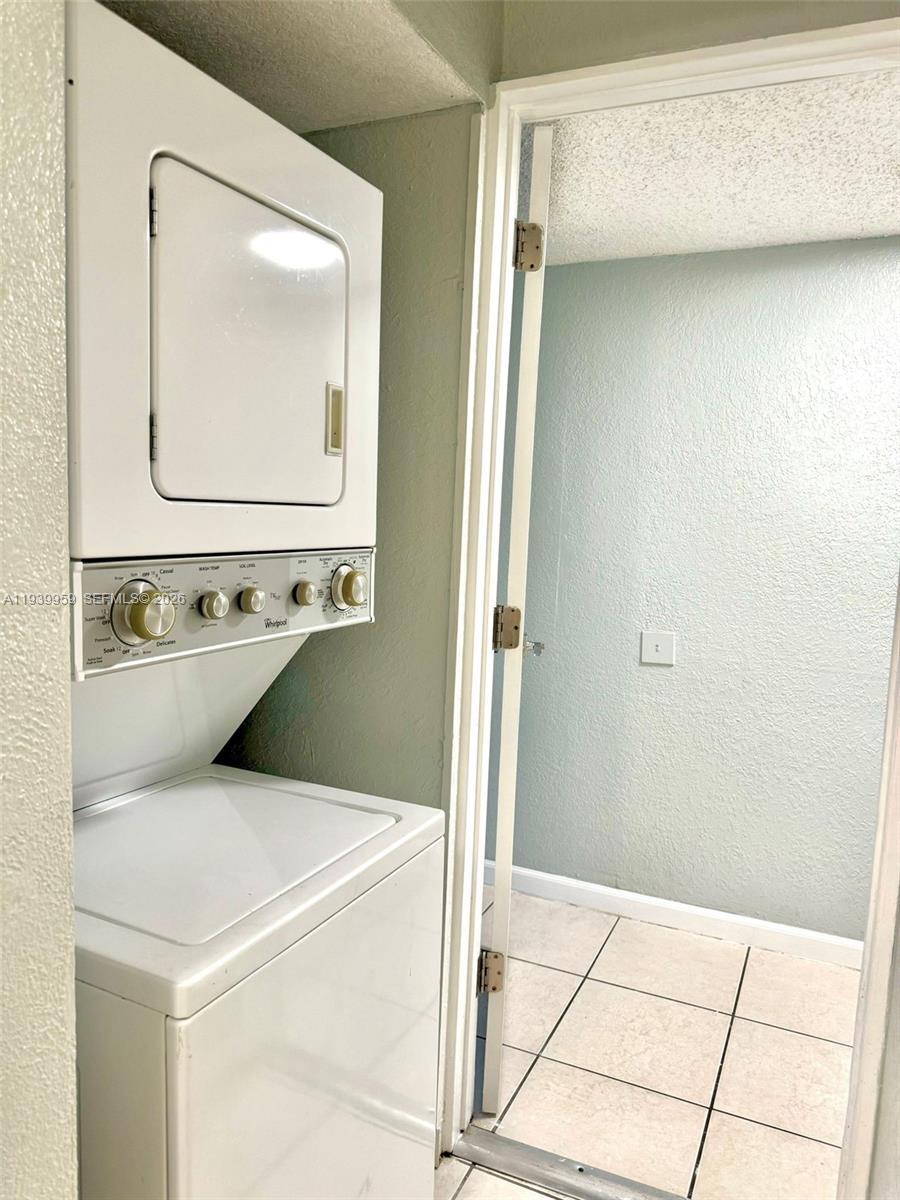 220 West 68th Street, Unit 101 Hialeah, FL 33014 - Photo 10 of 28 a bathroom with a sink a mirror and vanity