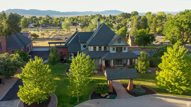 426 West Center Street Parowan, UT 84761 - Photo 107 of 107 Grand residential estate featuring a multi-gabled roofline, brick and siding exterior, and a covered front porch
