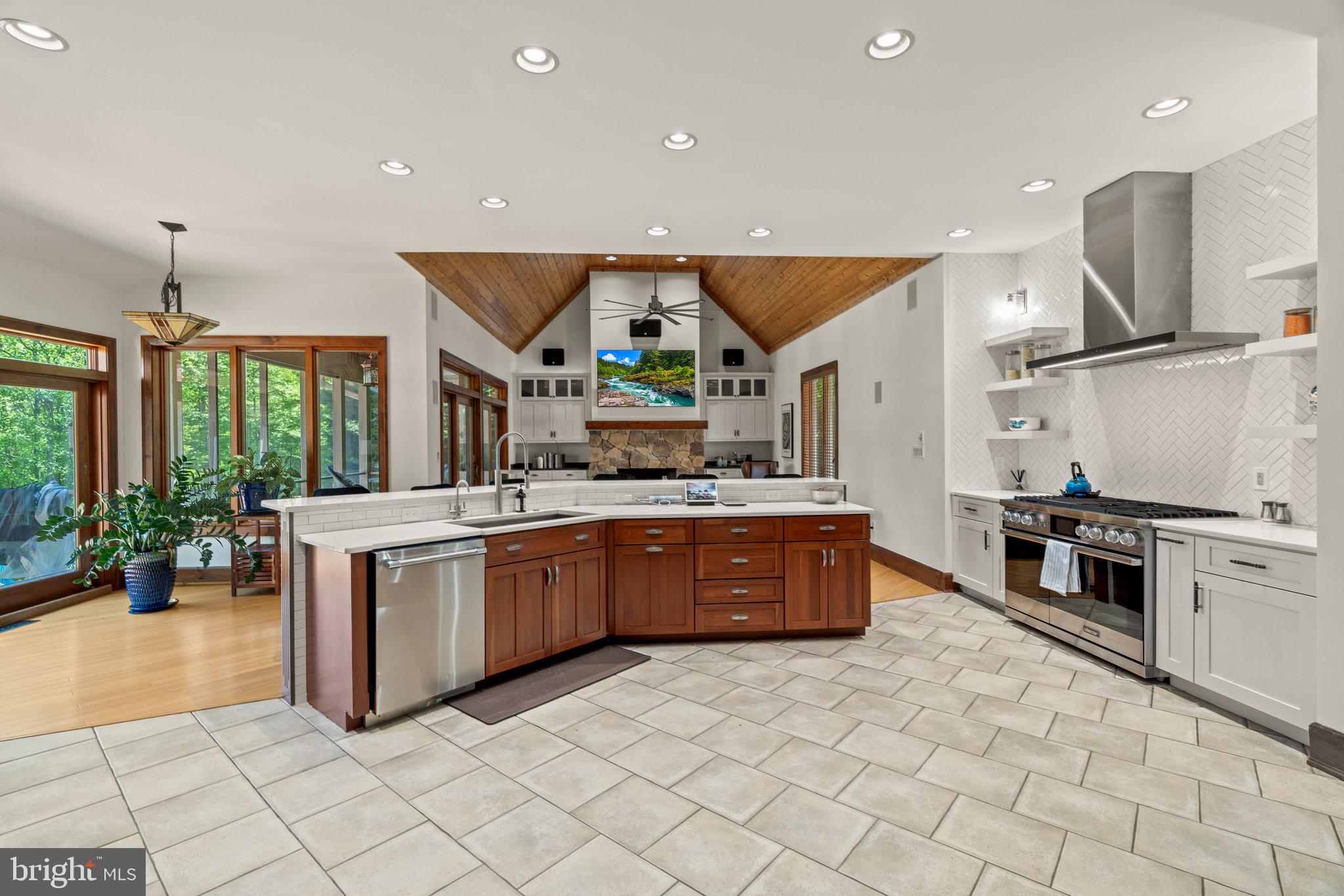477 Heritage Sewell, NJ 08080 - Photo 13 of 64 a kitchen with stainless steel appliances granite countertop a stove a sink and a refrigerator