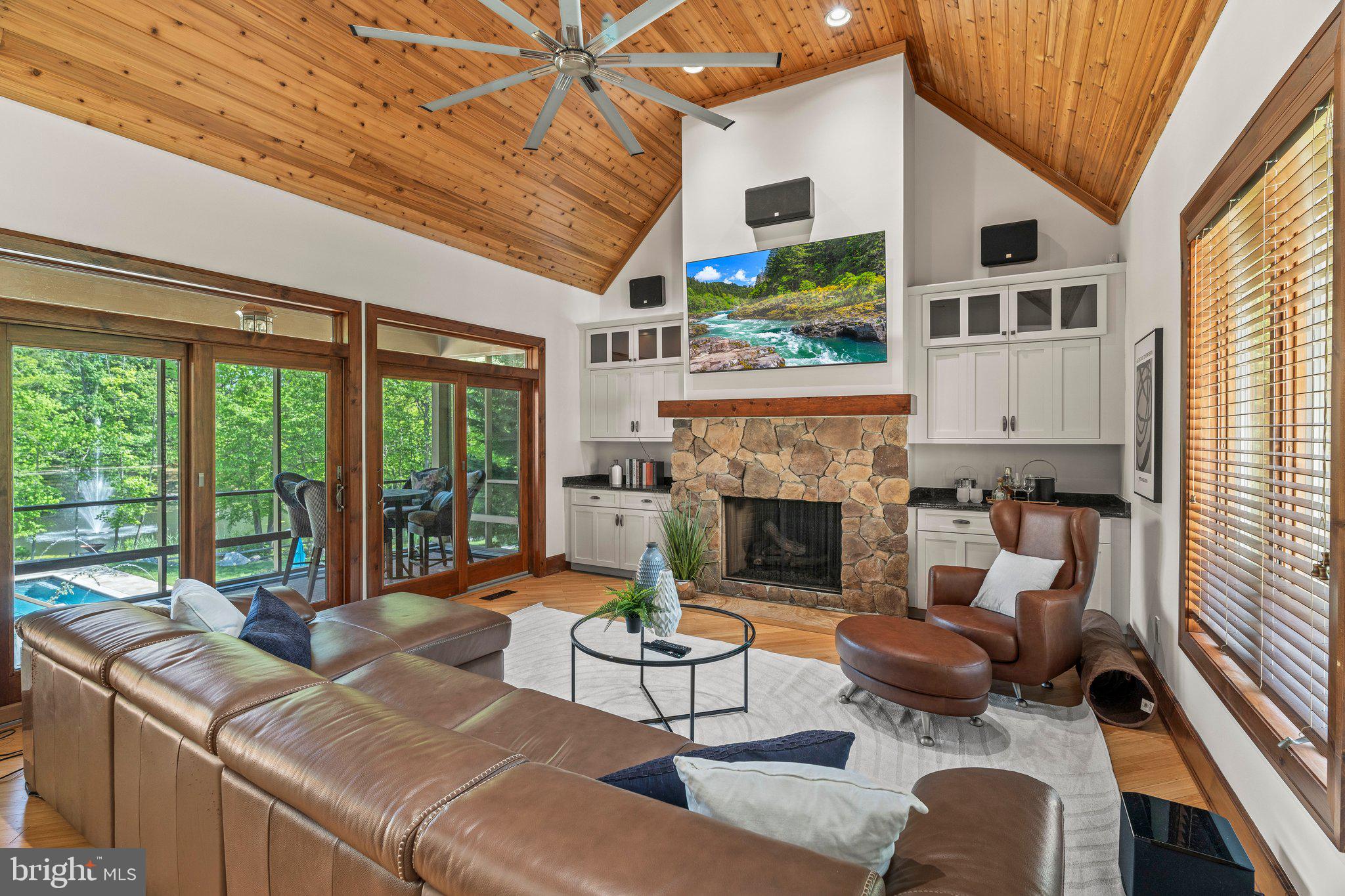 477 Heritage Sewell, NJ 08080 - Photo 19 of 64 a living room with furniture fireplace and large windows