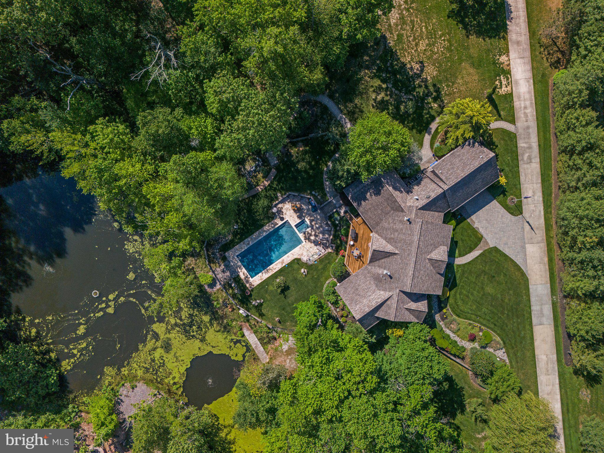 477 Heritage Sewell, NJ 08080 - Photo 2 of 64 an aerial view of a house with a yard and lake view