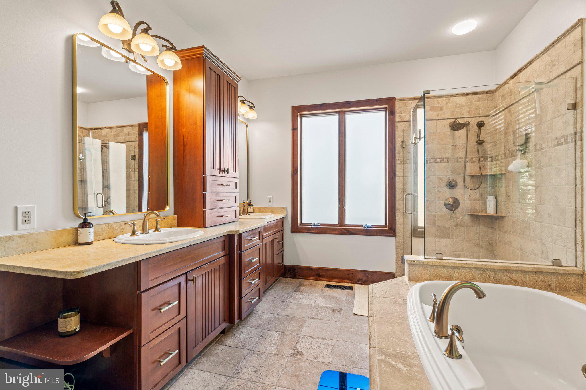 477 Heritage Sewell, NJ 08080 - Photo 27 of 64 a bathroom with a granite countertop tub sink and mirror