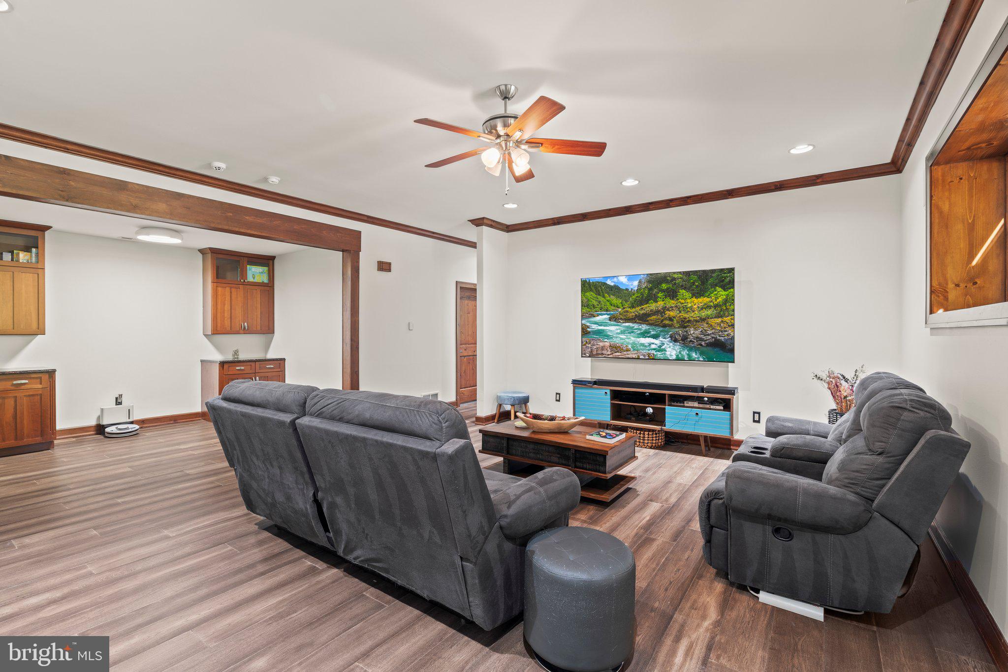477 Heritage Sewell, NJ 08080 - Photo 40 of 64 a living room with furniture and a flat screen tv