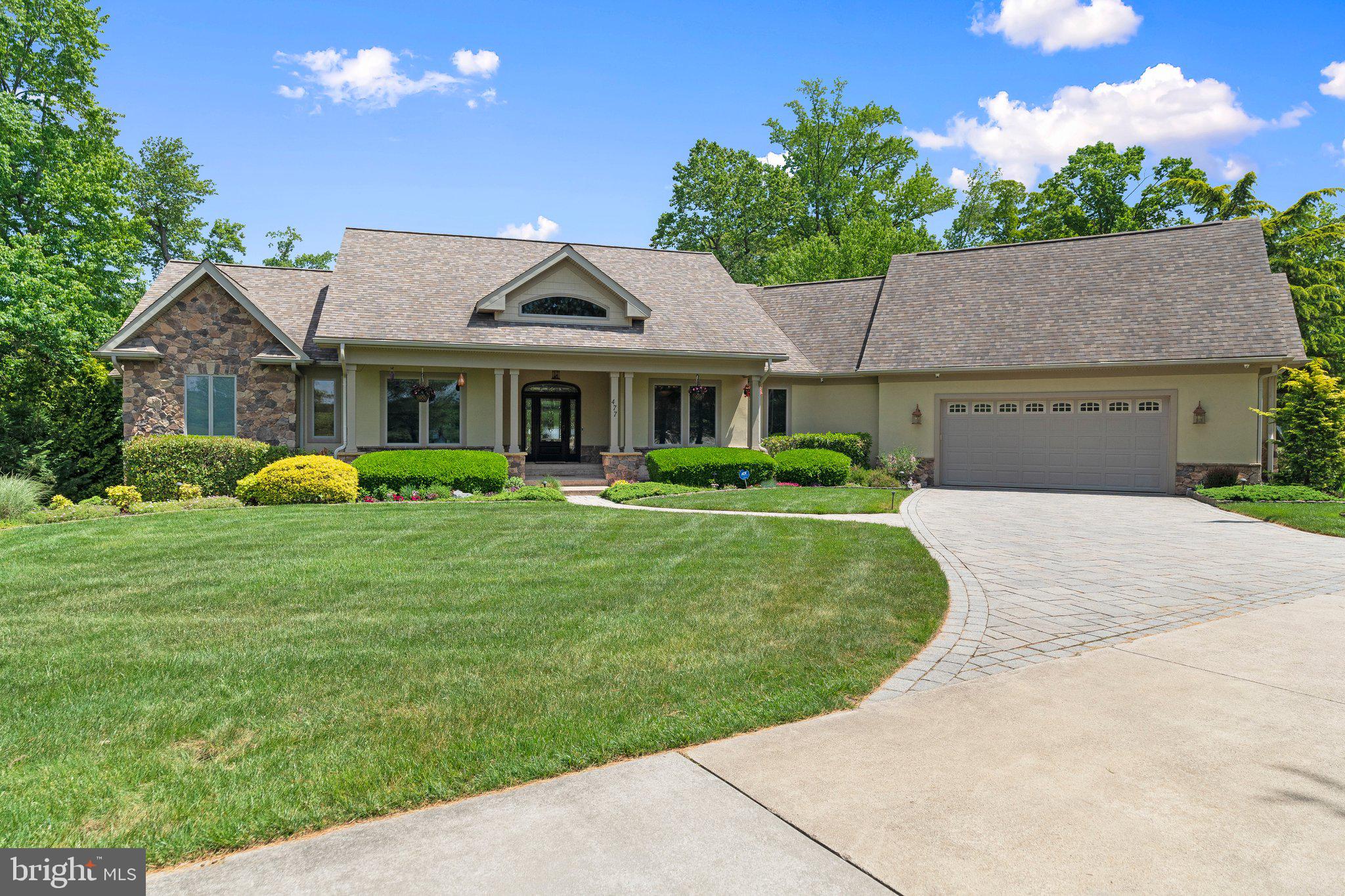 477 Heritage Sewell, NJ 08080 - Photo 4 of 64 a front view of a house with a garden