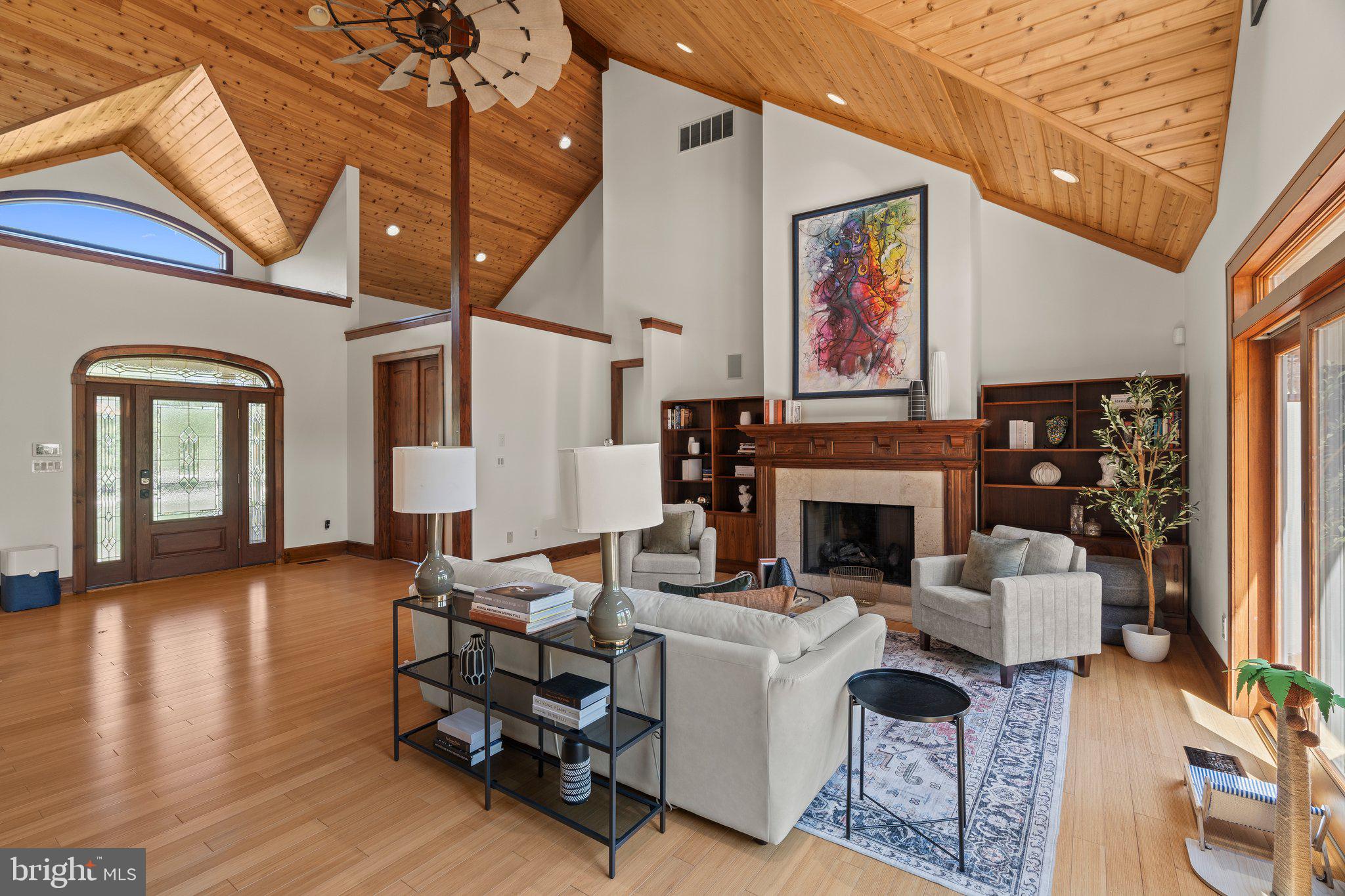 477 Heritage Sewell, NJ 08080 - Photo 9 of 64 a living room with furniture a fireplace and a large window
