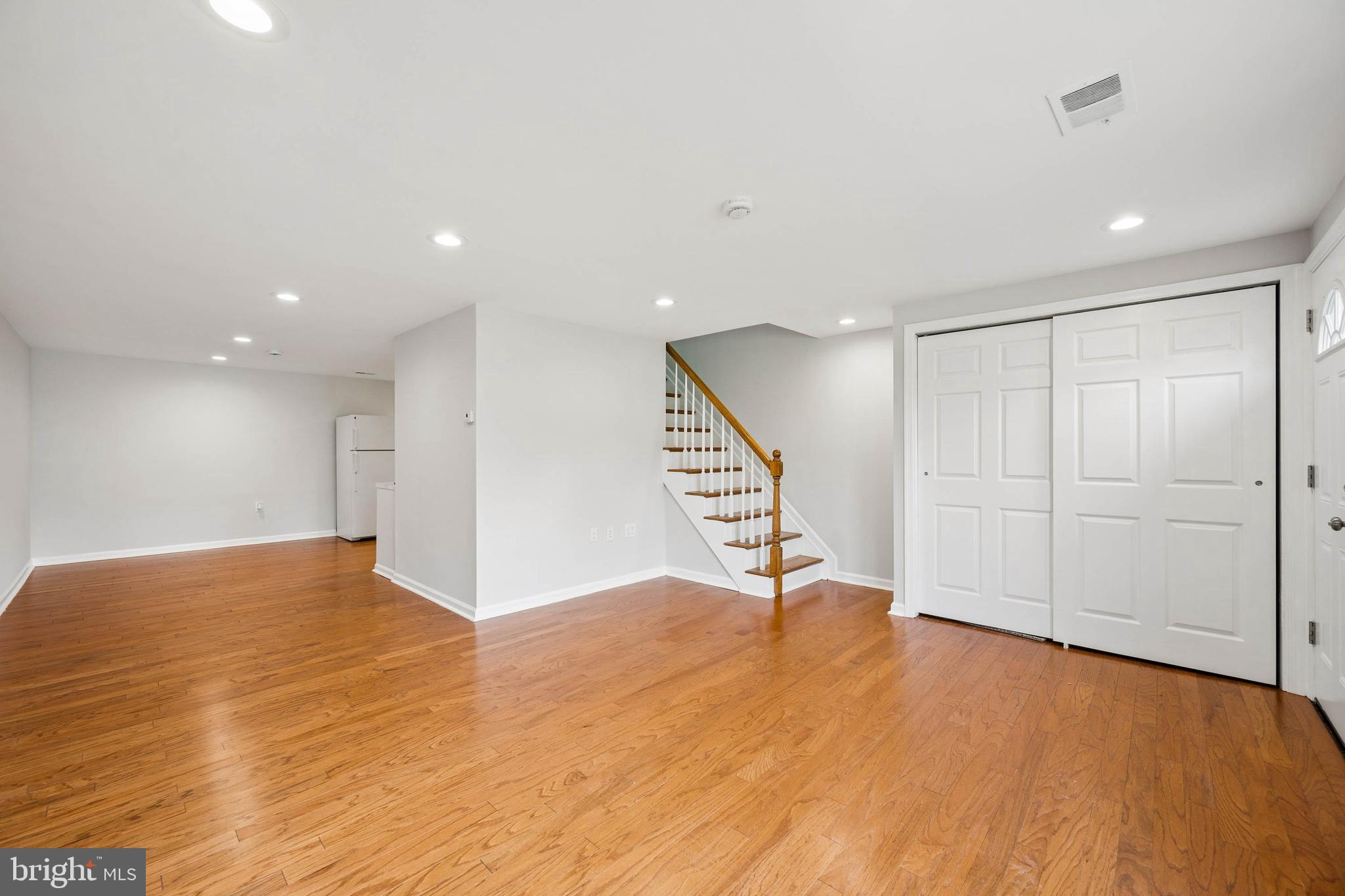 7227 Sindall Road Baltimore, MD 21234 - Photo 9 of 62 a view of an empty room with wooden floor