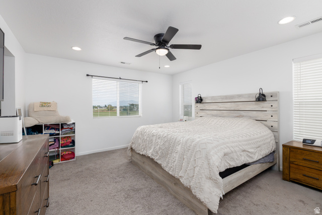 4594 West 1100 South West Point, UT 84015 - Photo 19 of 43 Recessed lighting, ceiling fan, window with blinds, and light gray carpet
