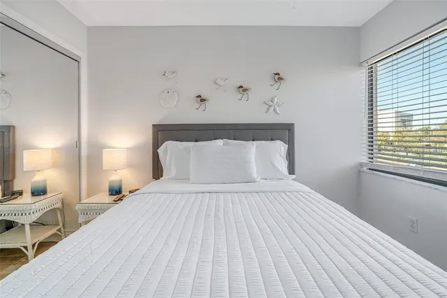 a bedroom with a bed and window