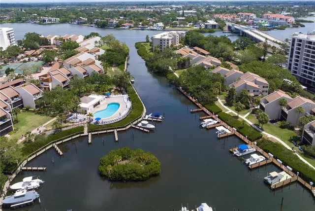 an aerial view of a house with a lake view