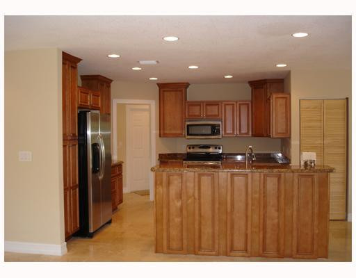 4130 Northeast 30th Avenue Lighthouse Point, FL 33064 - Photo 2 of 15 a kitchen with stainless steel appliances a refrigerator and a sink