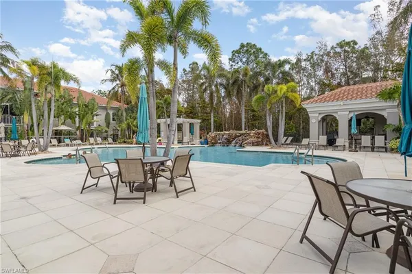 a view of a patio with couches and table and chairs