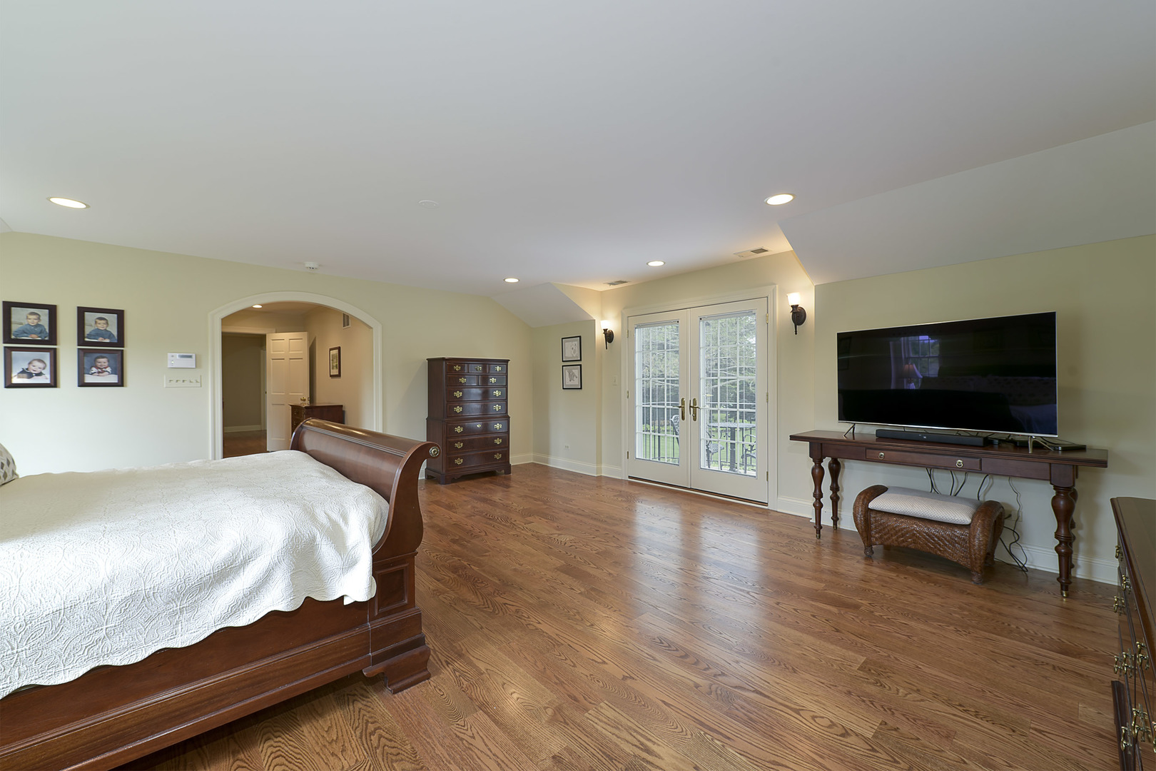1720 Firth Road Inverness, IL 60067 - Photo 15 of 34 a bedroom with furniture and a flat screen tv