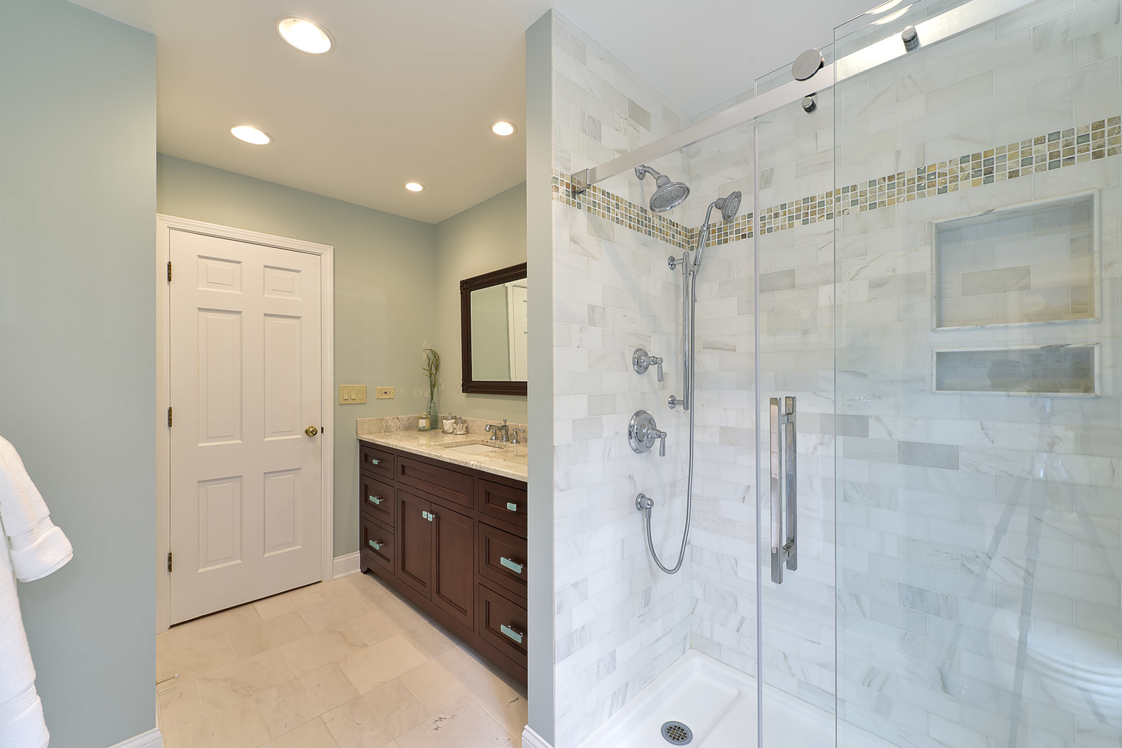 1720 Firth Road Inverness, IL 60067 - Photo 23 of 34 a bathroom with a double vanity sink mirror and shower