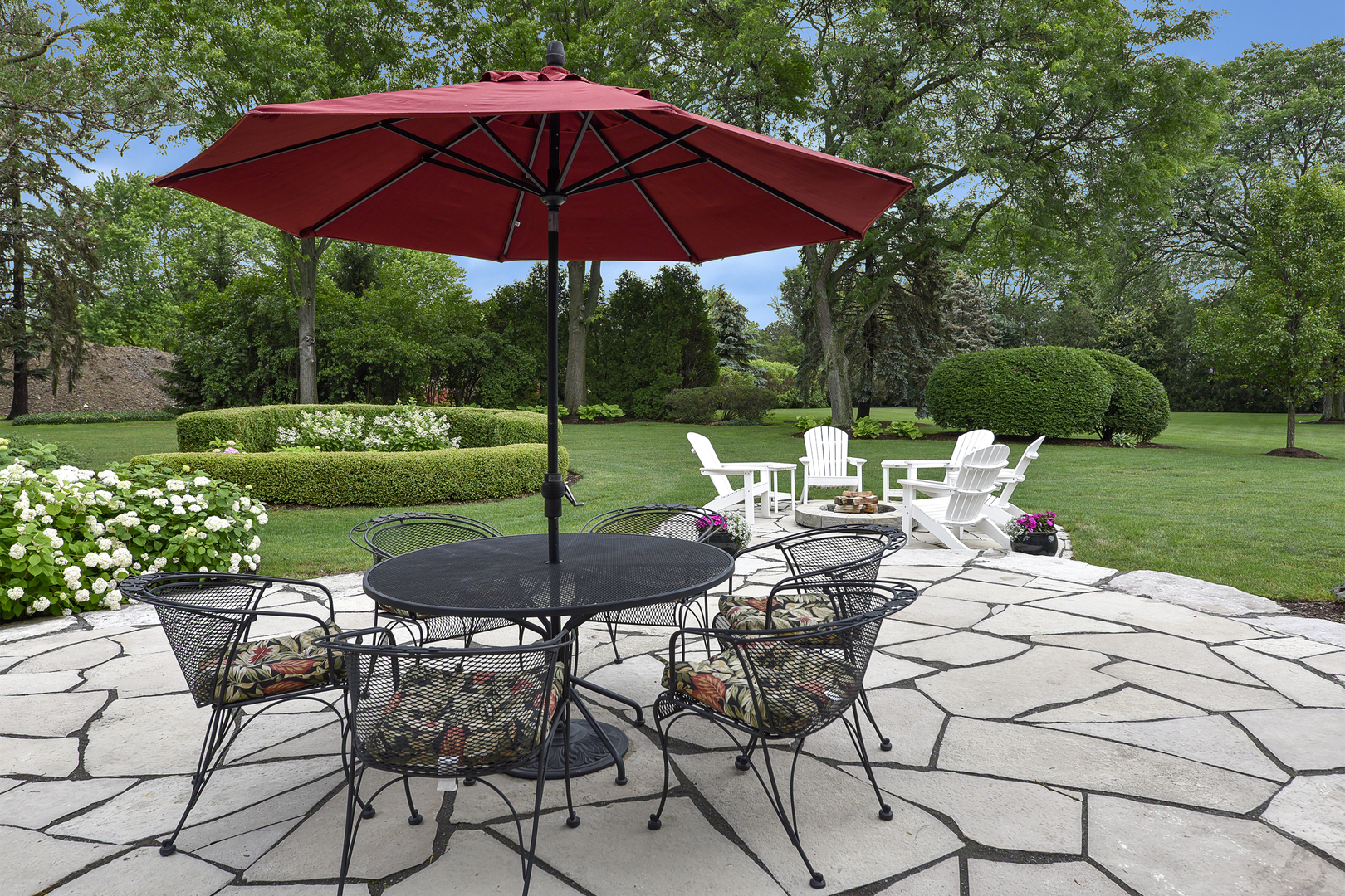 1720 Firth Road Inverness, IL 60067 - Photo 28 of 34 a view of a table and chairs under an umbrella