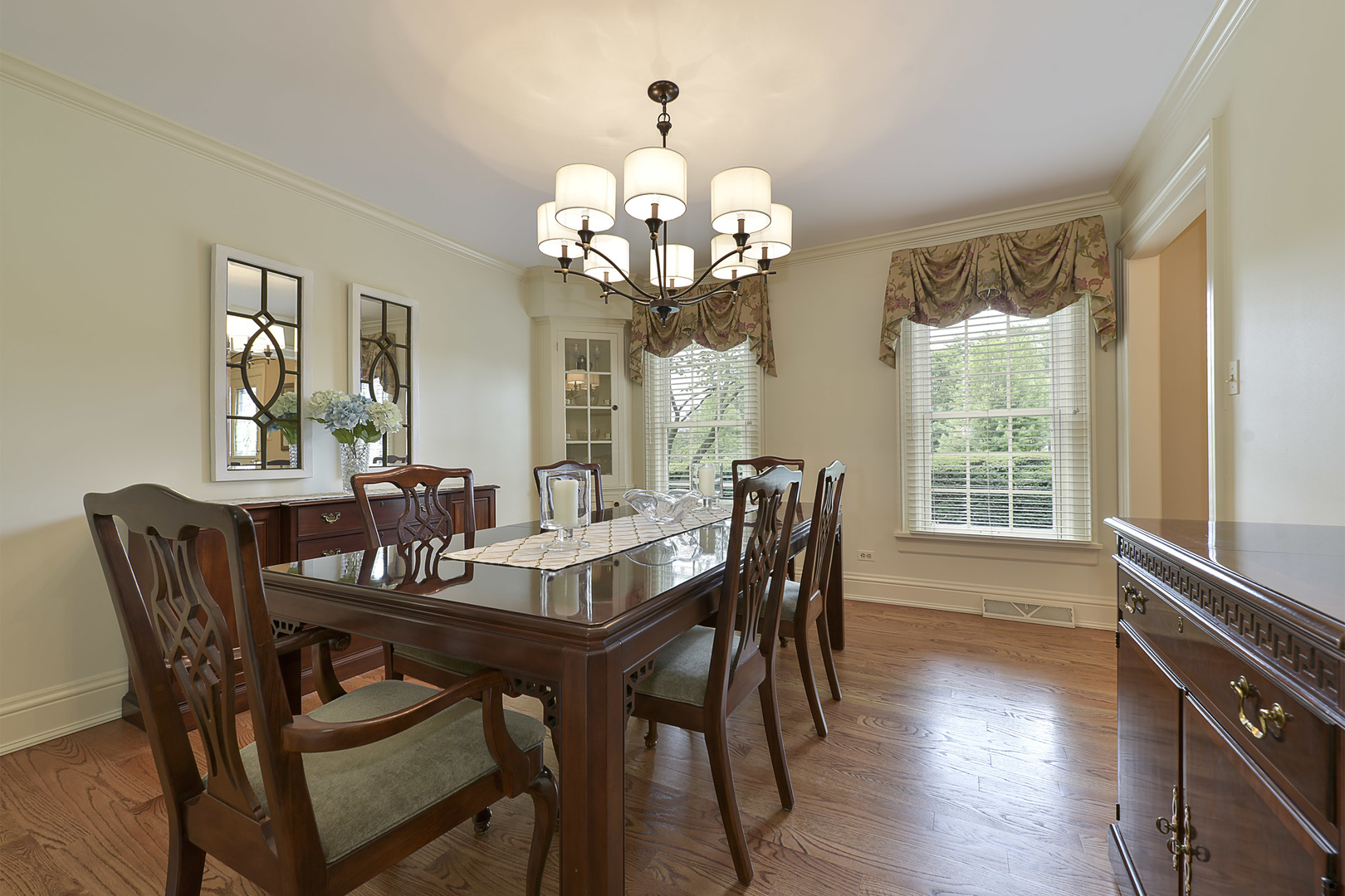 1720 Firth Road Inverness, IL 60067 - Photo 9 of 34 a view of a dining room with furniture a chandelier and wooden floor